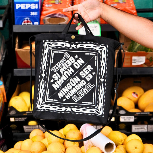 NO HUMAN BEING IS ILLEGAL Tote Bag